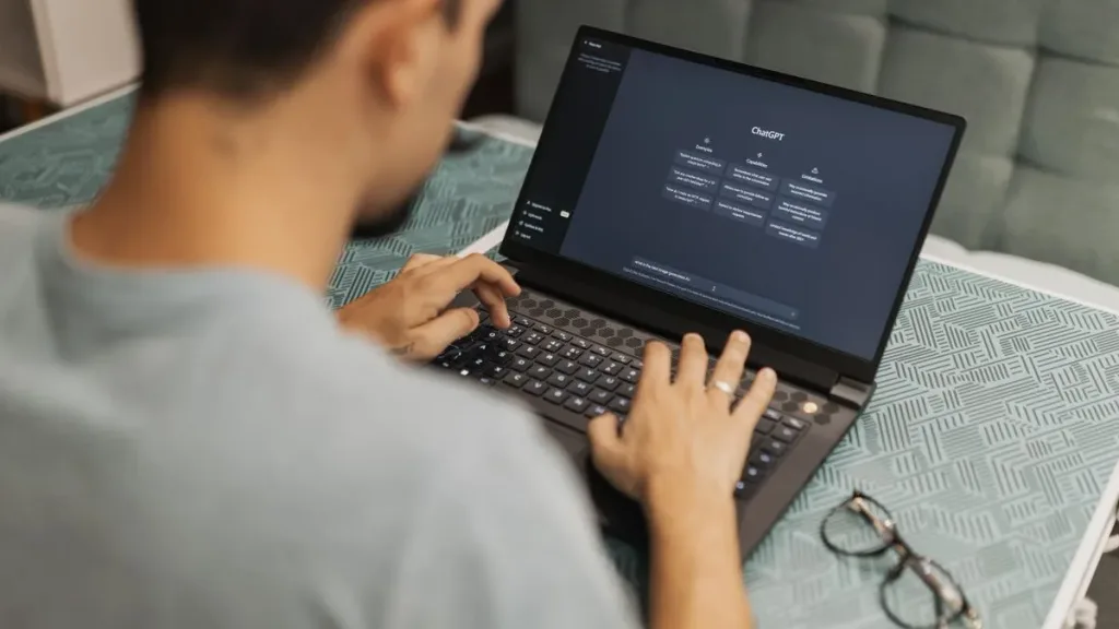 Man using a laptop with an AI chat interface for digital marketing